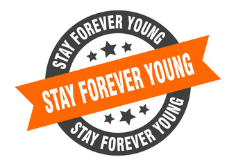 Fototapeta premium stay forever young sign. stay forever young round ribbon sticker. stay forever young tag