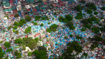 The northern cemetery in Manila with many graves and crypts in the city center aerial view. Travel...