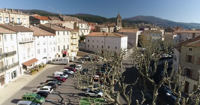 Close aerial shot of Privas, Ard&egrave;che, a small French town with nice trees in foreground
