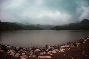 Mountain lake in the fog.