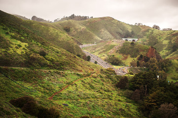 View on Marin Headlands and road to Sausalito from Golden Gate Bridge, San Francisco, California,...