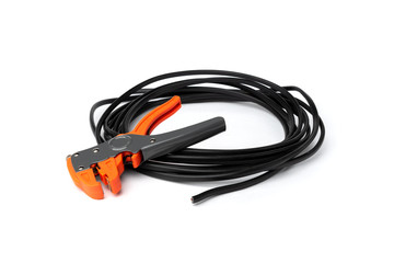 Automatic wire stripper and black cable isolated on white background.