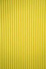 Abstract pattern of  yellow background with straight lines textured. wooden material room wallpaper interior decorative, modern style, copy space.