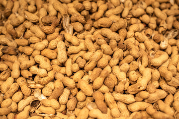 Peanuts in their shell texture food background fresh delicious vivid golden