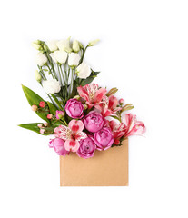 Colorful flowers and green leaves in craft envelope.