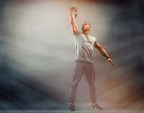 Strong Muscular Men, Cross Training Athlete Exercise With Kettlebell. Copy Space