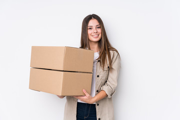 Young caucasian woman moving to a new home happy, smiling and cheerful.