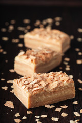 Traditional thousand layer cake on dark wooden table