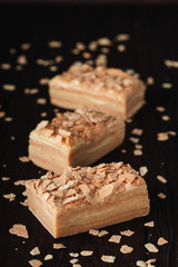 Traditional thousand layer cake on dark wooden table