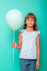 Little girl holding a balloon