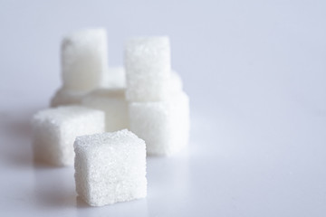 White sugar cube on white background.