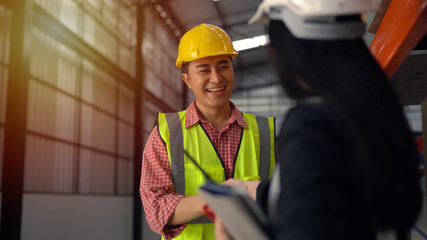 warehouse workers shaking hand
