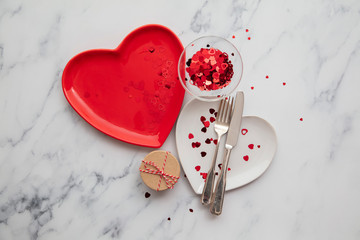 Valentine's day gift box with heart shaped plates and confetti