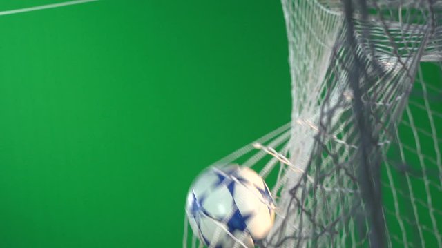 Goal scored in a soccer match. The unbranded star football hits the back of the net.  Super Slow motion. Green Screen Chroma Key