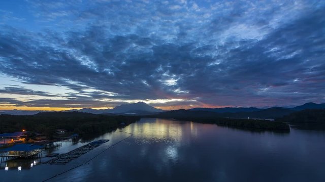 4K Timelapse of Beautiful harmony sunrise color with dramatic movement cloud in Gayang Tuaran, Sabah, Malaysia 