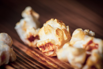 Popcorn flakes on a wooden background