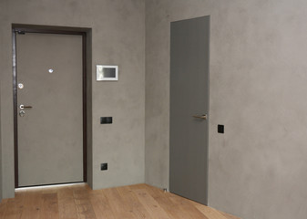 House metal entrance door with mounted  control panel of smart house system