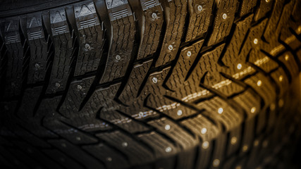 car tire with studs, macro, blurred background