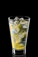 Glass of cold water with ice cubes and pear syrup isolated on black