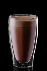 Double wall glass of hot chocolate isolated on black