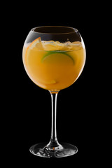 Cold sangria in wine glass isolated on black