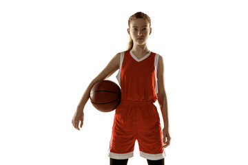 Young caucasian female basketball player posing confident isolated on white background. Redhair...