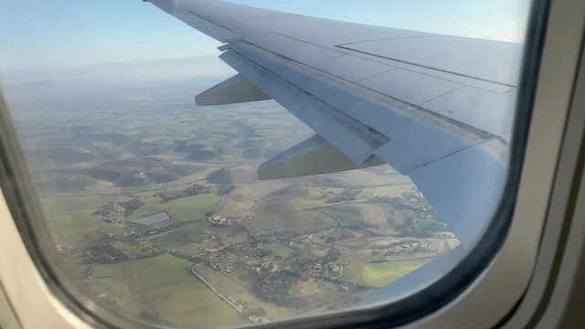 View from airplane window. Flying over Italy, Rome.