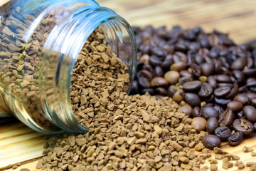 Instant coffee lies next to the beans on the table