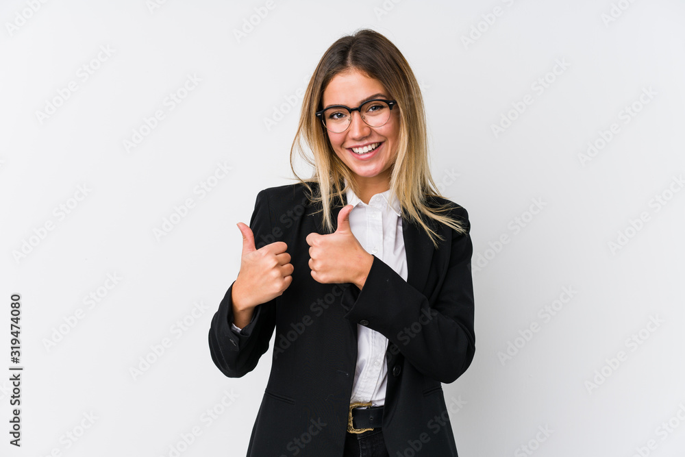 Wall mural Young business caucasian woman raising both thumbs up, smiling and confident.