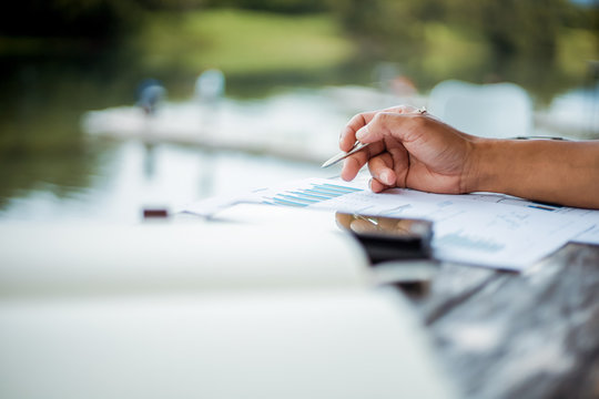 Businessman use stylas pen for writing mobile phone.