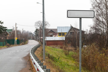 Empty road sign for town name