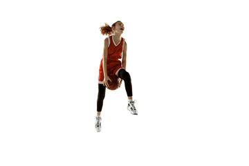 Fototapeta na wymiar Young caucasian female basketball player in action, motion in jump isolated on white background. Redhair sportive girl. Concept of sport, movement, energy and dynamic, healthy lifestyle. Training.