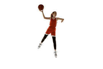 Fototapeta na wymiar Young caucasian female basketball player in action, motion in jump isolated on white background. Redhair sportive girl. Concept of sport, movement, energy and dynamic, healthy lifestyle. Training.