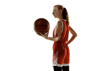 Young caucasian female basketball player posing confident isolated on white background. Redhair...