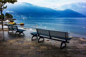 Naklejka na ściany i meble Benches on shore f lake Maggiore, Ascona, Switzerland.