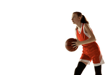 Young caucasian female basketball player in action, motion in run isolated on white background....