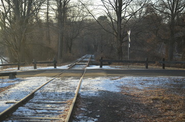 A railroad crossing in a rural area