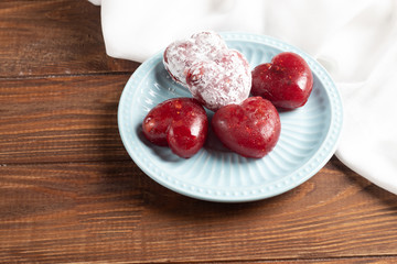 Mother's Day, Women's Day, Valentine's Day or Birthday. Jelly hearts from berries of raspberries, strawberries, applesauce on a light plate.