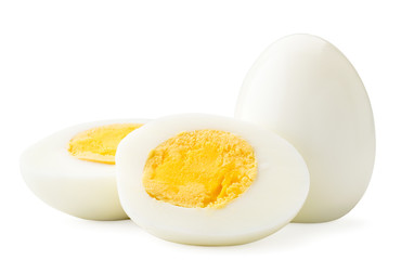 Boiled egg and two halves close-up on a white. Isolated