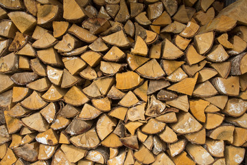 Stacks of Firewood. Preparation of firewood for the winter.