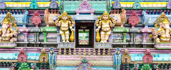 Aerial front view of colorful facade of a Hindu temple in Victoria, Mahe, Seychelles