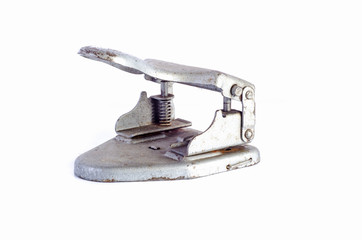 vintage tool for piercing holes in paper ( punch ) isolated on a white background