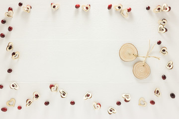 Romantic White Wooden Background, Eco Banner, Copy Space with Two Empty Medallions and all Framed of Hearts and Red Berries. Still Life Flat Lay Composition for Valentine Day, Holiday, Wedding, Add