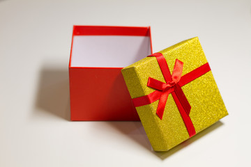 red open box with a red bow on a white background. A gift for Valentine's Day. Gift to a man on February 23. birthday, mother's Day, women's day. Gift for people. space for text. banner.