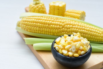  fresh organic corn in leaf, shelled and in pieces