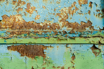 Old rusty metal surface. Old paint falls off the metal. The structure of the old paint.