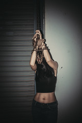 Asian hostage woman Bound with rope at night scene,The thieves kidnapped for ransom,thailand people