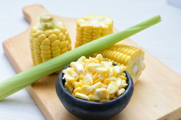  fresh organic corn in leaf, shelled and in pieces