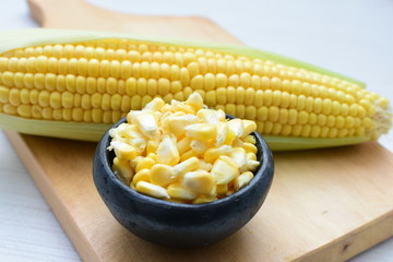  fresh organic corn in leaf, shelled and in pieces