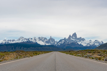 Empty road with the Mount Fitz Roy on the background. Patagonia, Argentina